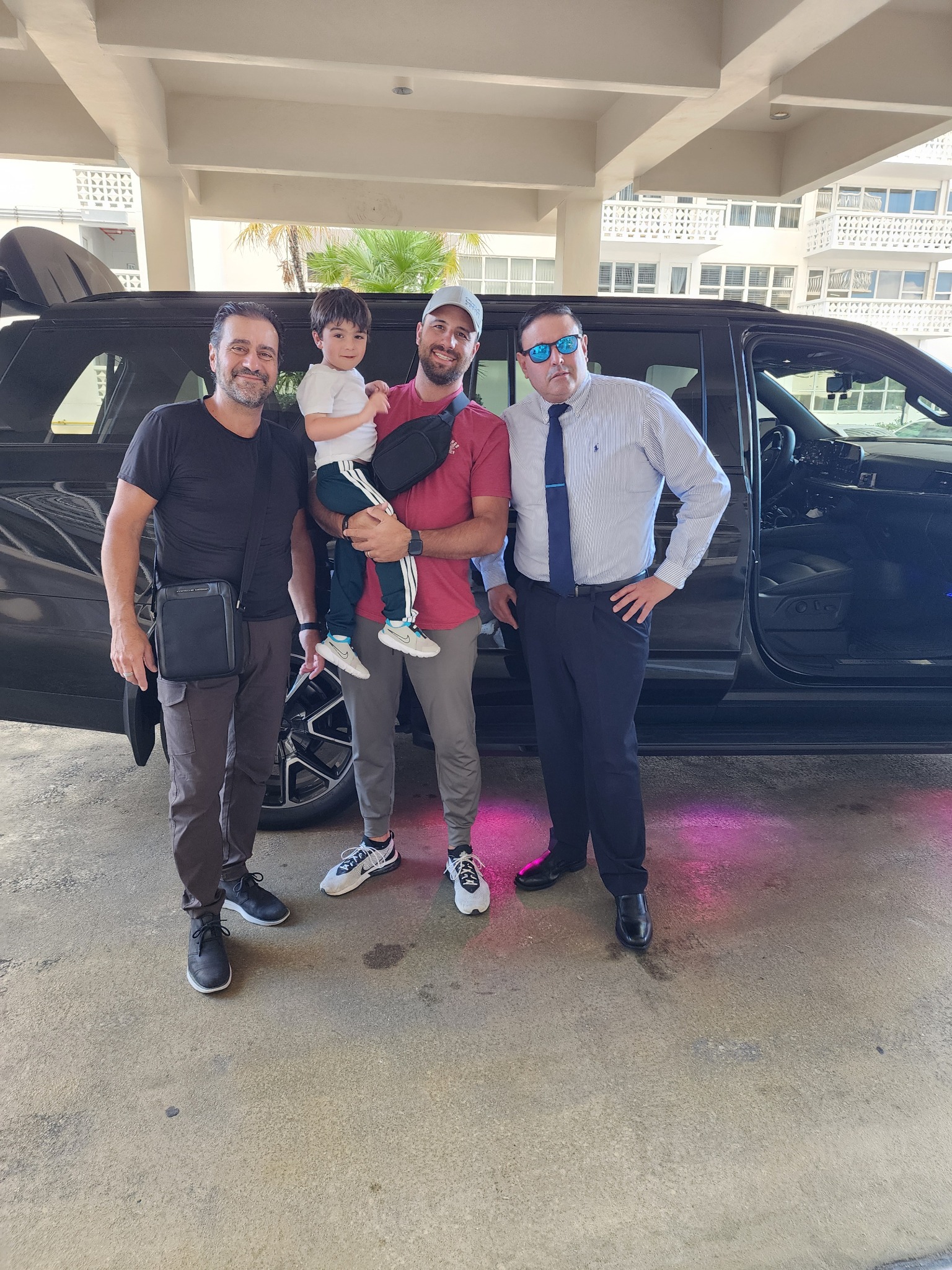 Happy guests with Suburban and pink lights